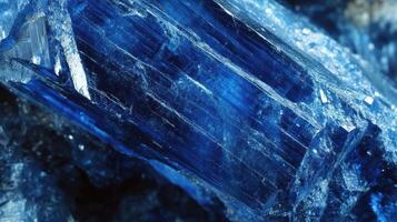Deep blue kyanite crystal with unique formations and clear facets. photo