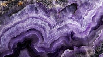 Close-up of charoite crystal with swirling purple patterns photo