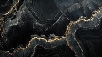 Detailed view of onyx stone, emphasizing its deep black hues intertwined with shimmering gold veins. photo