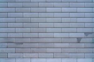 Brick wall of the building. Designer building background. photo