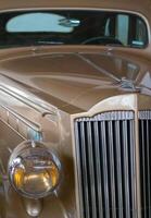 Vintage, shiny car against the background of the night sky. photo
