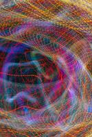 A pattern of glowing lines of light. Abstract design background. photo