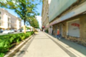 Blurred background of a city street. Blurred photo of a modern city.