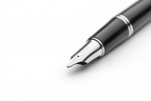 Elegant silver fountain pen lying on a white sheet of paper photo