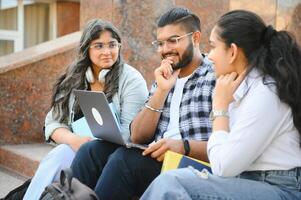 Group of smiling multiethnic near university campus photo