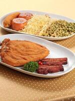 Cuban Chicken Supreme with tomatoes, bacon and fried banana photo