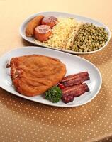 Cuban Chicken Supreme with tomatoes, bacon and fried banana photo