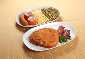 Cuban Chicken Supreme with tomatoes, bacon and fried banana photo