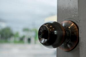 Open door knob or open the door to the outside. photo