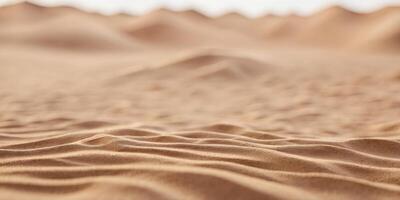 A close-up view of desert sand with ripples formed by the wind. photo