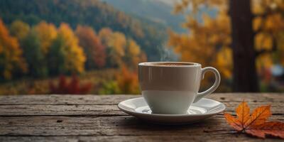 Cup of fresh coffee and autumn on wooden table on blur nature background. photo
