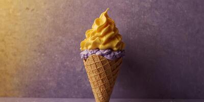 Waffle ice cream cone with purple seashell shaped scoop inside Yellow background Minimal summer concept. photo