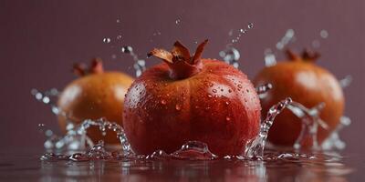 Pomegranates Splashing in Water with a Pink Background. photo