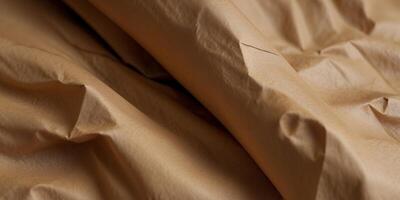 A close-up of vintage brown kraft paper with wrinkles and creases. photo