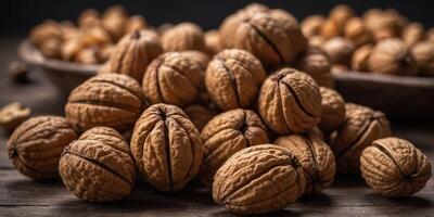 Fresh walnuts in a shell close-up The background is made of nuts. photo
