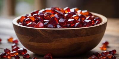 Rustic Wooden Bowl Filled with Rough-Cut Red Gemstones in Natural Light. photo