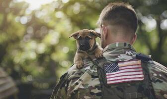 An American soldier holds his dog in shoulder with an american flag and blurred greenery in background photo