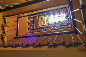 Up view of the staircase in the building. Horizontal view photo