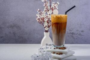 Iced Coffee Latte with Milk Layers and Coffee Beans photo