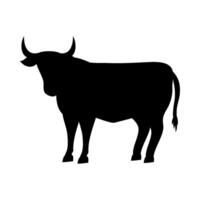A black silhouette of a bull standing on a white background vector