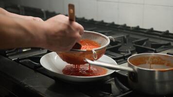 Ladle And Strainer To Create The Perfect Tomato Cream photo