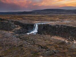 Aerial panorama of the Oxarafoss waterfalls in Iceland. Oxarafoss also called Oxararfoss is located in the Thingvellir National Park on the Oxara River. The tectonic plates of America and Eurasia. photo