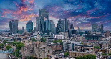 Aerial panoramic view of the city of London business center. Close up view of the riverside near river Thames. photo