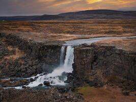 Aerial panorama of the Oxarafoss waterfalls in Iceland. Oxarafoss also called Oxararfoss is located in the Thingvellir National Park on the Oxara River. The tectonic plates of America and Eurasia. photo