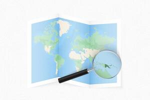 Enlarge Papua New Guinea with a magnifying glass on a folded map of the world. vector