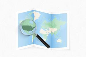 Enlarge USA with a magnifying glass on a folded map of the world. vector