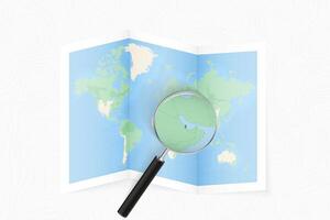 Enlarge Qatar with a magnifying glass on a folded map of the world. vector