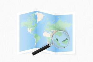 Enlarge Malaysia with a magnifying glass on a folded map of the world. vector