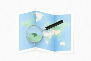 Enlarge Venezuela with a magnifying glass on a folded map of the world. vector