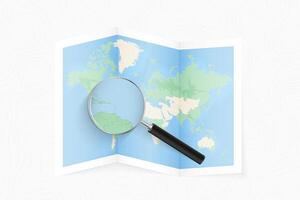 Enlarge Saint Kitts and Nevis with a magnifying glass on a folded map of the world. vector