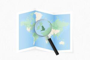 Enlarge England with a magnifying glass on a folded map of the world. vector