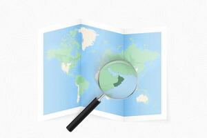 Enlarge Oman with a magnifying glass on a folded map of the world. vector