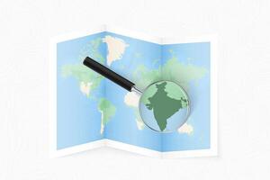 Enlarge India with a magnifying glass on a folded map of the world. vector