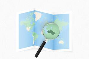 Enlarge Turkmenistan with a magnifying glass on a folded map of the world. vector