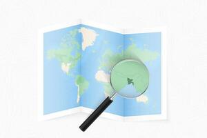 Enlarge Bangladesh with a magnifying glass on a folded map of the world. vector