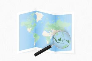 Enlarge Indonesia with a magnifying glass on a folded map of the world. vector