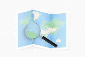 Enlarge Trinidad and Tobago with a magnifying glass on a folded map of the world. vector