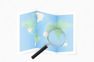 Enlarge Maldives with a magnifying glass on a folded map of the world. vector