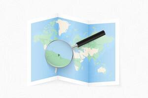 Enlarge French Guiana with a magnifying glass on a folded map of the world. vector