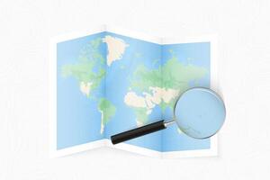 Enlarge Marshall Islands with a magnifying glass on a folded map of the world. vector