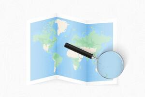 Enlarge Samoa with a magnifying glass on a folded map of the world. vector