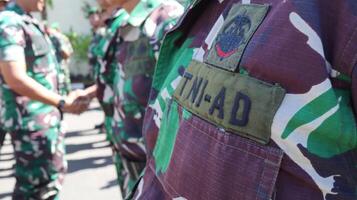 The Indonesian Army or TNI AD are conducting a parade of troops photo