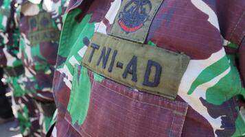 The Indonesian Army or TNI AD are conducting a parade of troops photo
