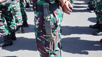 The Indonesian Army or TNI AD are conducting a parade of troops photo