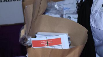 Voting atmosphere at TPS Tempat Pemungutan Suara, Indonesian Polling Place photo