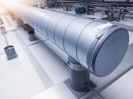Oxygen air supply line pipe from air handling unit machine to chicken egg incubation machine. photo